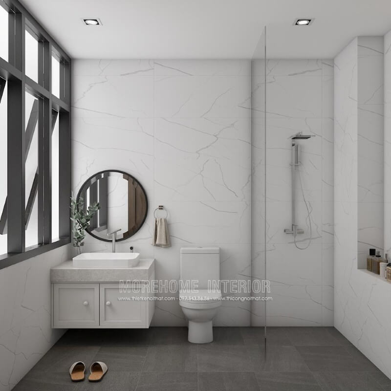 Thiết kế phòng tắm hiện đại với kính cường lực và đá ốp tường màu trắng vân mây tạo sự thoáng mát và sạch sẽ