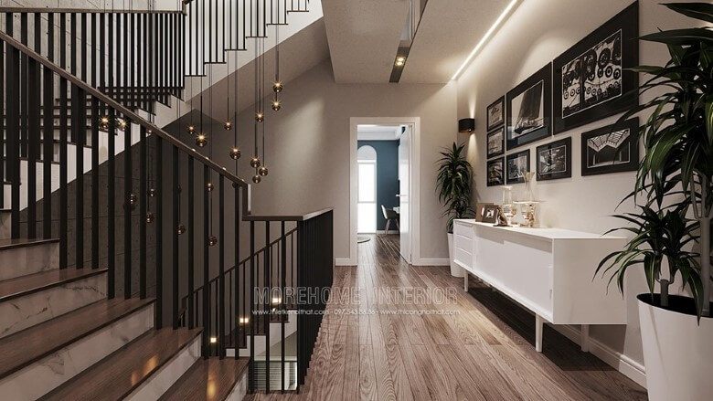 Hành lang nhà được trang trí với một kệ gỗ decor hiện đại có màu trắng đẹp.